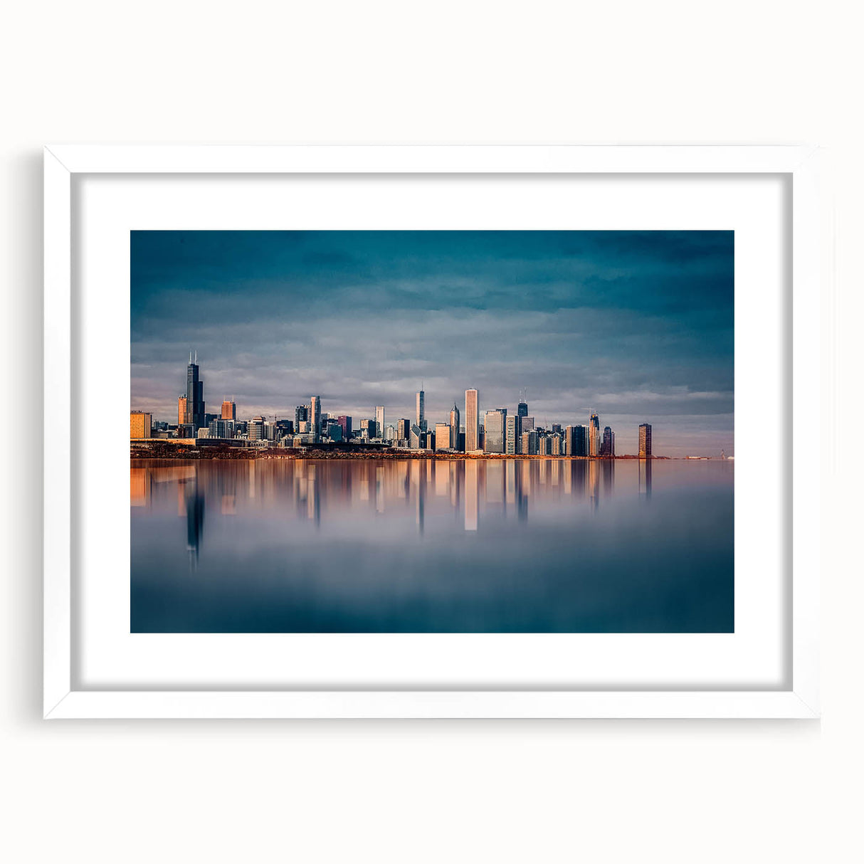 Abstract art print of Chicago skyline in muted gray and blue tones on a framed white mat, suitable for dining room decor.