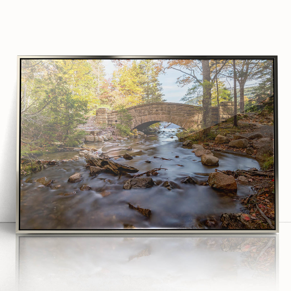 Mid-century modernist art depicting Acadia's coastline in muted earth tones on a silver-framed acrylic print.