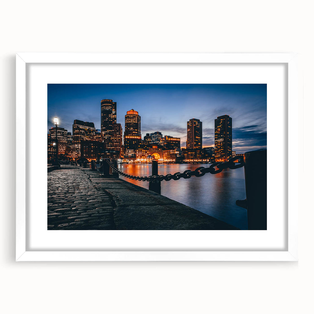 Abstract art print of Boston skyline in muted blue and gray tones on a framed white mat, ideal for dining room decor.