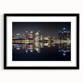 Abstract art print of Detroit skyline in vibrant colors on a large framed canvas, ideal for living room decor.