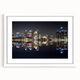 Abstract art print of Detroit skyline in muted gray and blue tones on a framed white mat, suitable for dining room decor.