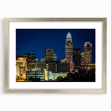 Textured abstract art print of Charlotte skyline in muted blue and silver tones, framed with a mat, ideal for bedroom art.