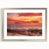 Textured art depicting the Outer Banks in abstract style with muted blue and gray tones on a framed silver mat.