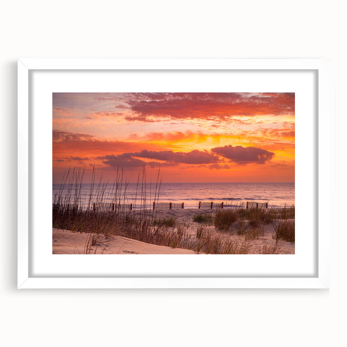 Abstract art print of the Outer Banks in North Carolina, featuring muted blue and green hues on a white-framed canvas.