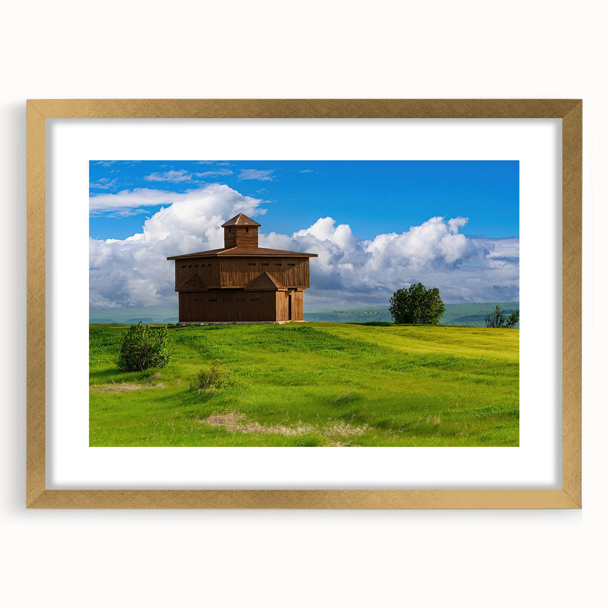 Extra large abstract art print depicting a textured North Dakota scenery in muted earth tones, framed in gold.
