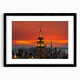 Colorful abstract art print of NYC skyline in vibrant hues on a large framed canvas, ideal for living room decor.