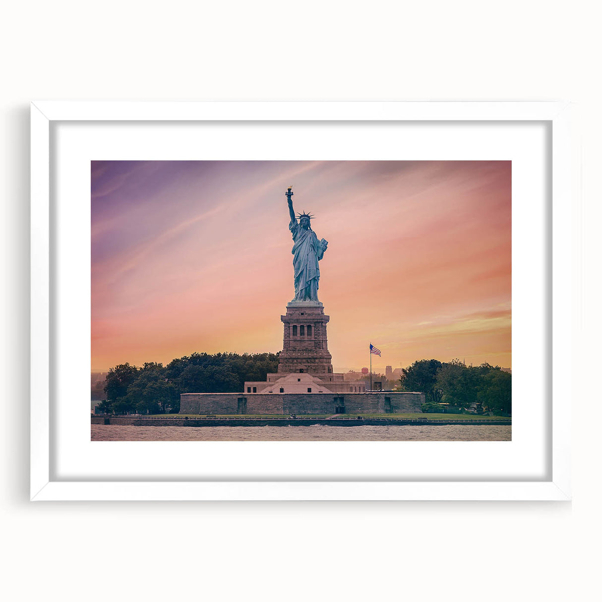 Abstract art print of the Statue of Liberty in muted blue tones, framed in white, ideal for bedroom or dining room decor.