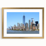 Extra large abstract art print of NYC skyline, featuring textured hues of gray and blue, in a gold frame.