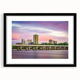 Abstract art print featuring textured, colorful swirls on a large black-framed canvas, ideal for living room decor.