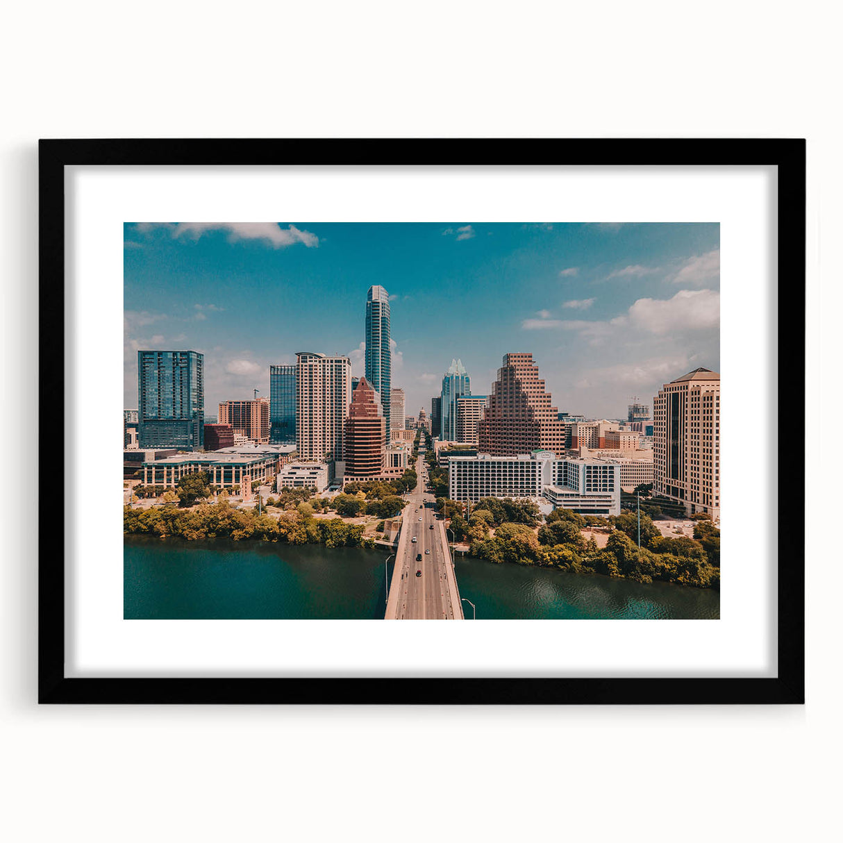 Extra large abstract art print of Austin, Texas, featuring vibrant colors on textured canvas, framed in black.