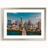 Textured abstract art print of Austin skyline in muted earth tones on a framed silver mat, suitable for bedroom decor.