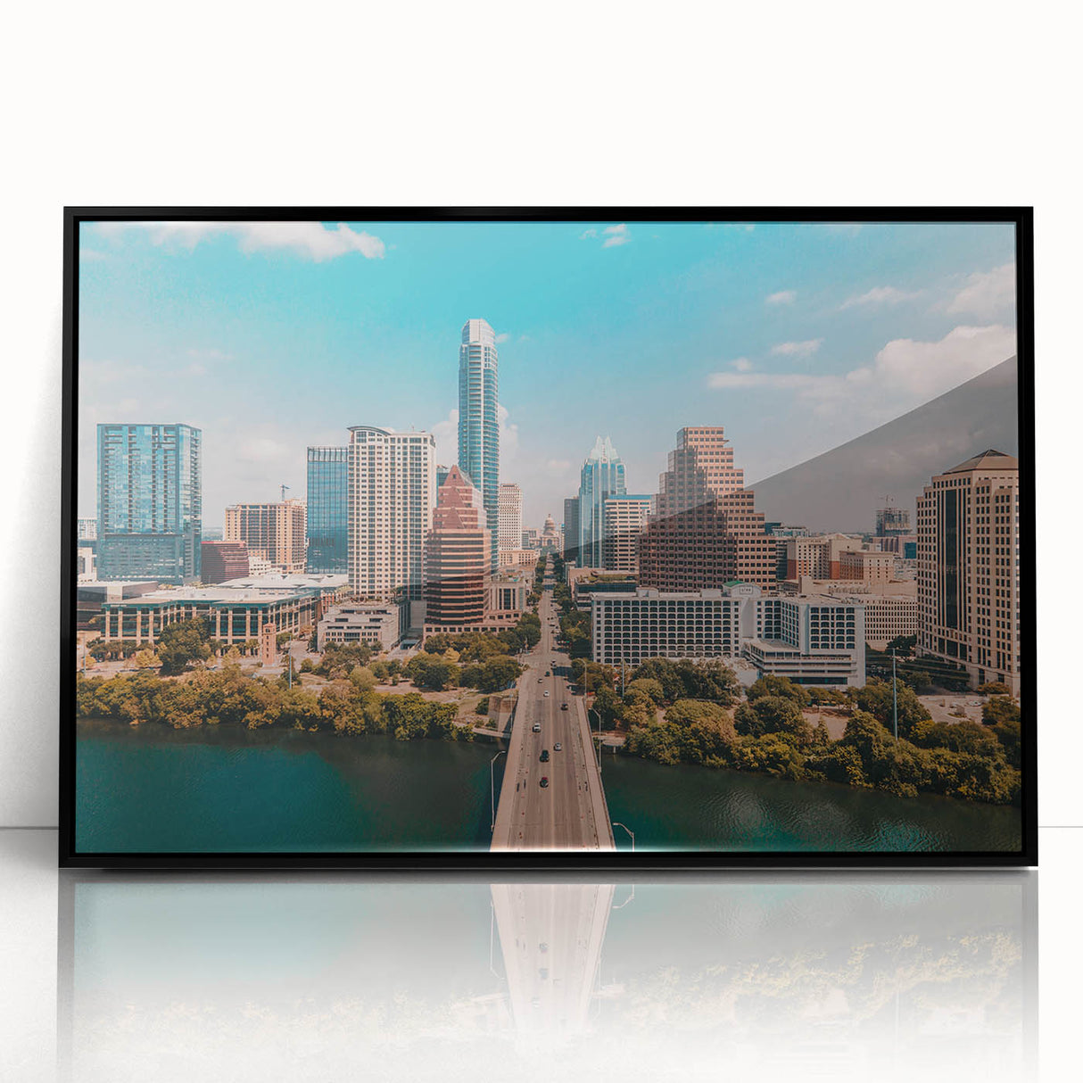 Large abstract wall art depicting the Austin skyline in muted gray and blue tones on a framed acrylic print.