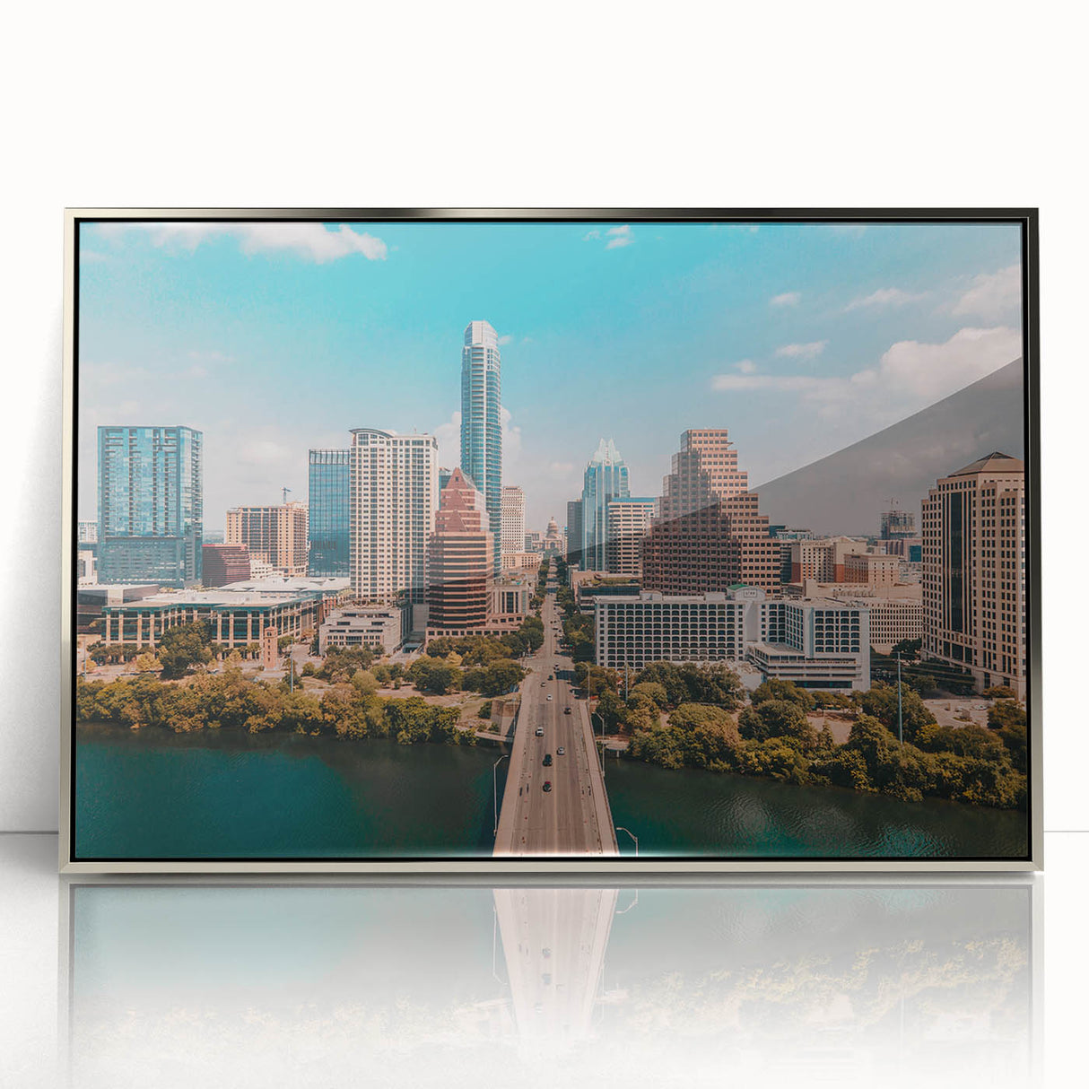 Mid-century modernist art of Austin, Texas skyline in silver-framed acrylic, featuring pastel shades.