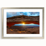 Textured art print of Arches National Park in muted earth tones on a framed silver mat, ideal for bedroom decor.