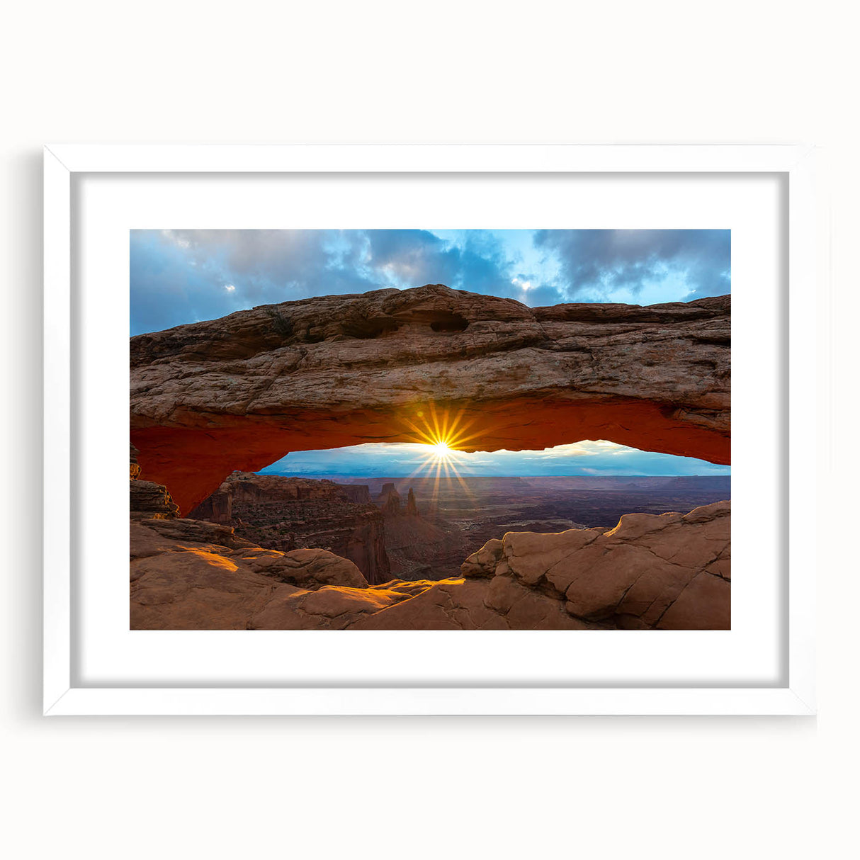 Abstract art print of Arches National Park in earth tones, on a white-framed canvas, suitable for dining room decor.