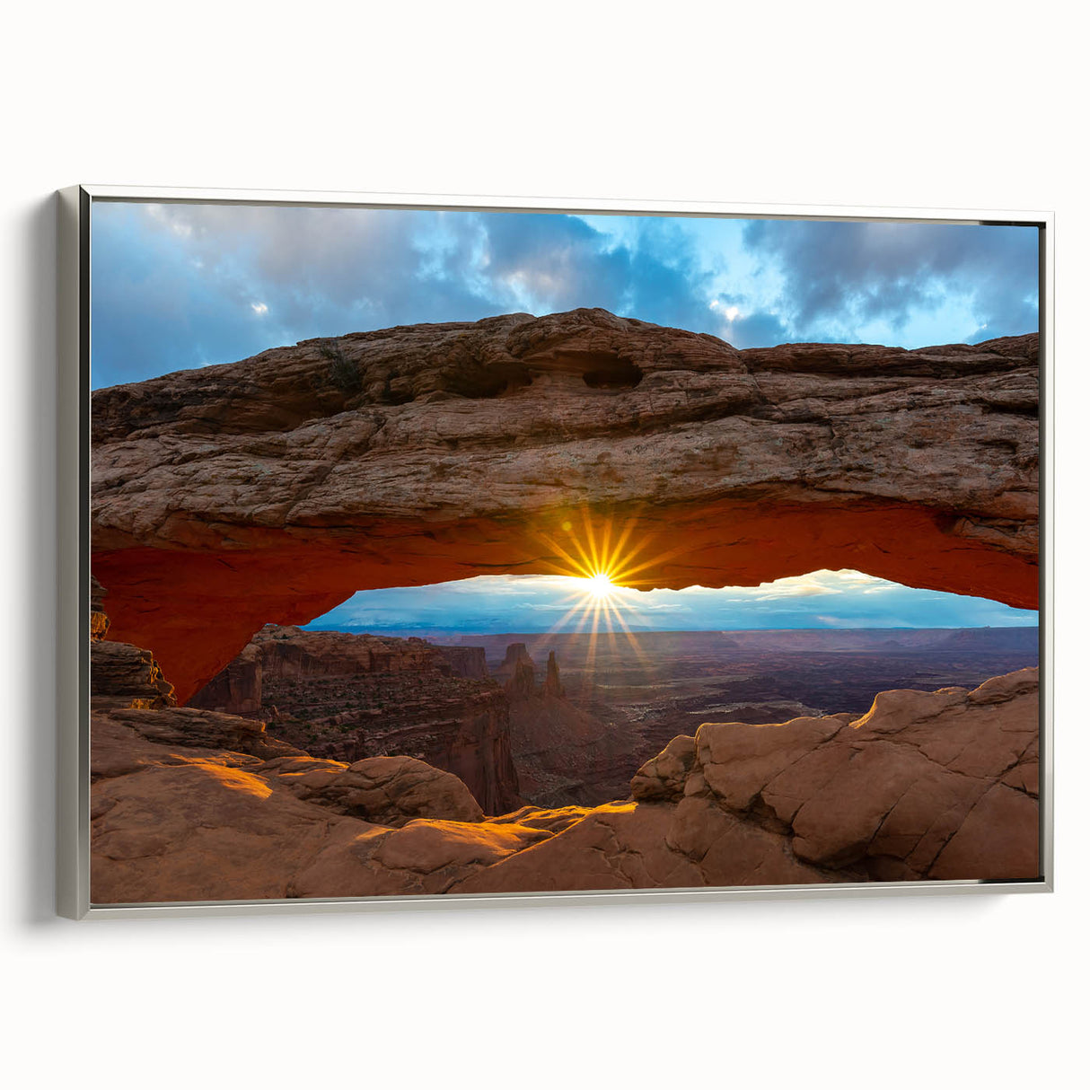 Framed canvas of a landscape art painting depicting Arches National Park in Utah, with a silver frame.