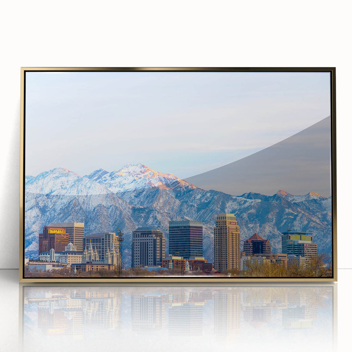 Framed acrylic print of Salt Lake City with muted gold and blue tones, in a mid-century modernist style.