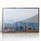 Framed acrylic print of Salt Lake City with muted gold and blue tones, in a mid-century modernist style.
