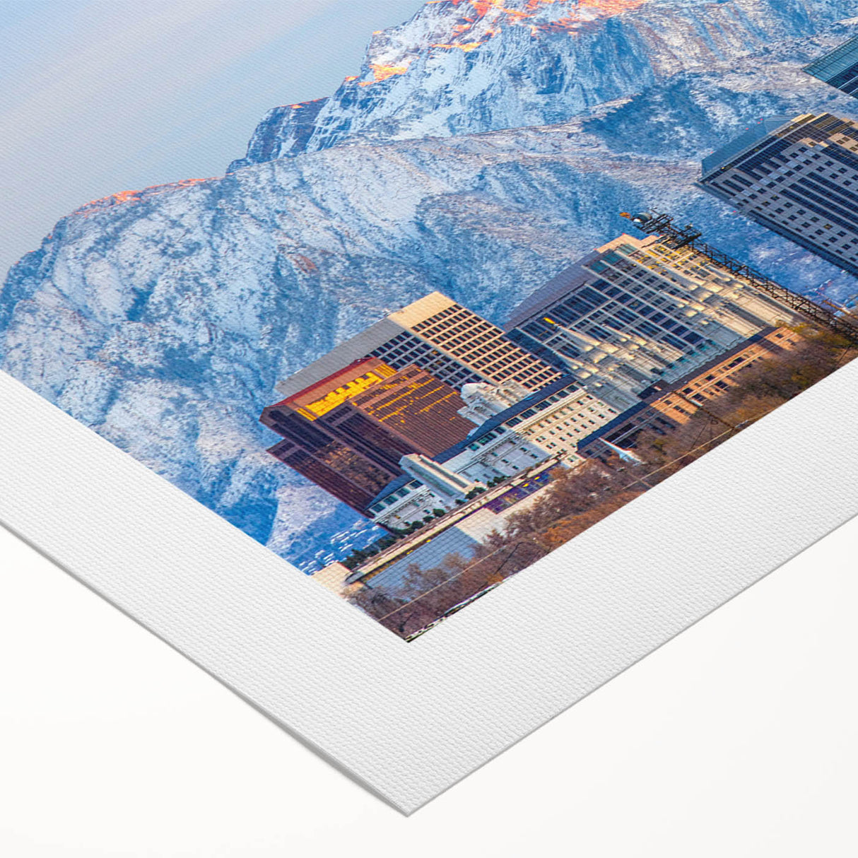Art deco poster featuring a stylized Salt Lake City skyline in muted blue and gray tones on rolled canvas.