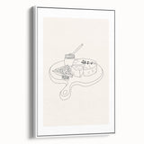 Framed canvas featuring vintage poster art of colorful dishes on a black background, suited for living room decor.