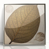 Framed wall art showcasing a vibrant floral design with colorful flowers and lush green leaves, displayed in a sleek silver frame, perfect for modern home decor.