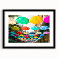 Extra large, colorful abstract art print of an African scenery in vibrant hues, framed with black mat.