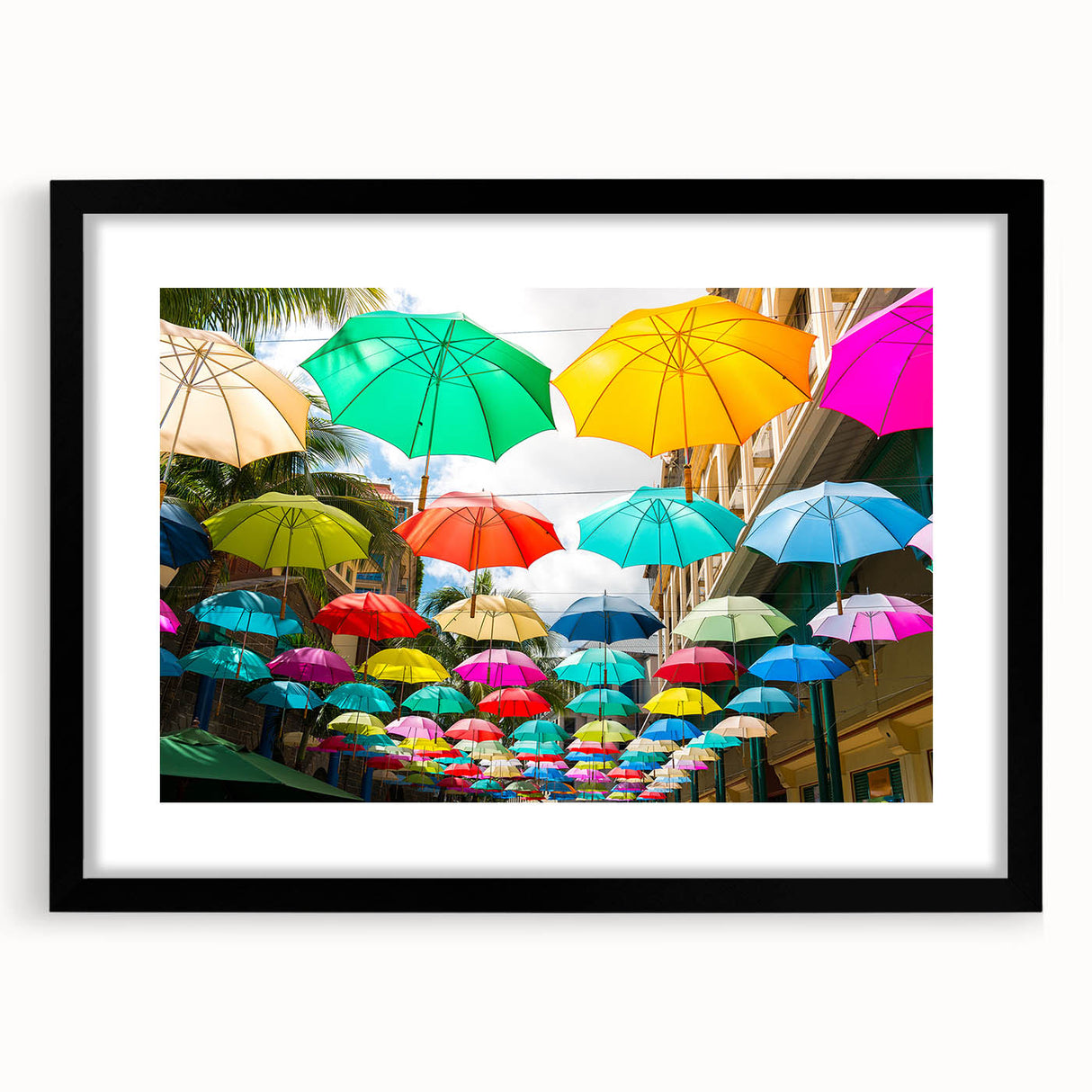 Extra large, colorful abstract art print of an African scenery in vibrant hues, framed with black mat.