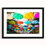 Extra large, colorful abstract art print of an African scenery in vibrant hues, framed with black mat.