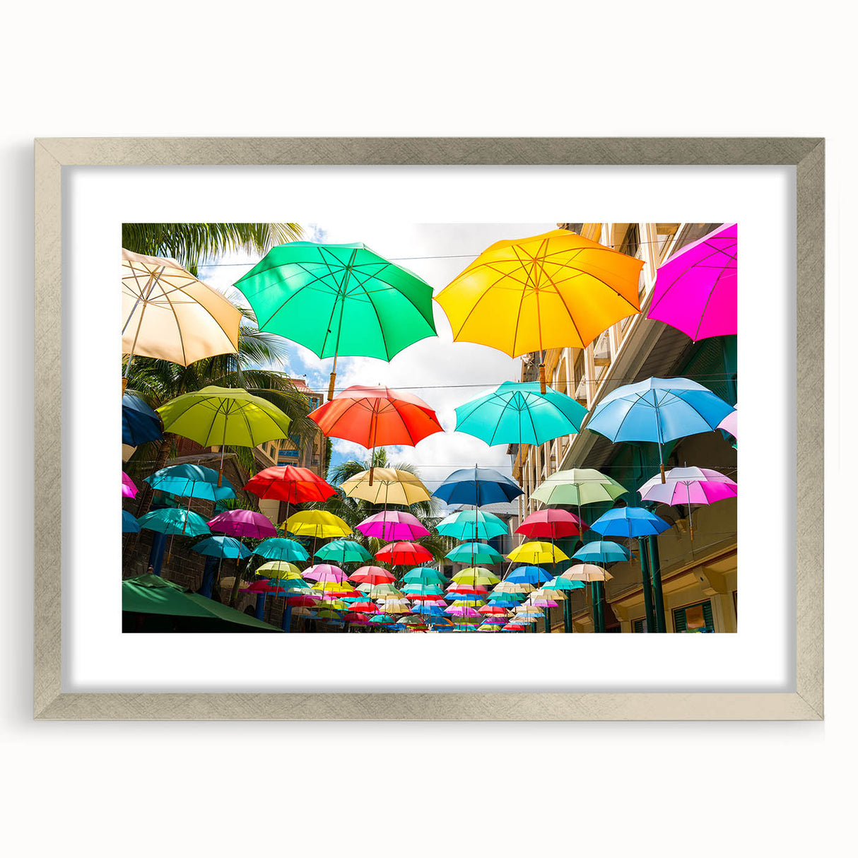 Abstract art print depicting a serene Mauritius landscape in soft blue and green tones, framed in silver.