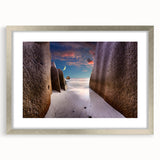 Textured art depicting an abstract Seychelles scenery in muted blue and green tones on a silver-framed mat.