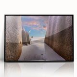 Large abstract wall art depicting a serene Seychelles landscape in muted blue and green tones, framed in black acrylic.