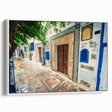 Vintage poster art of a Tunisian landscape in vibrant colors on a large framed canvas, ideal for living room decor.