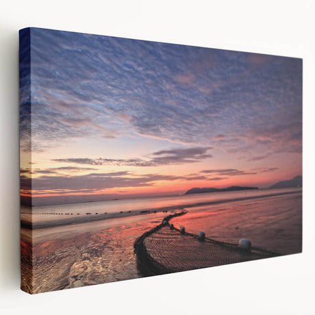Side view of a large stretched canvas depicting a Malaysian landscape in vibrant green and blue tones.
