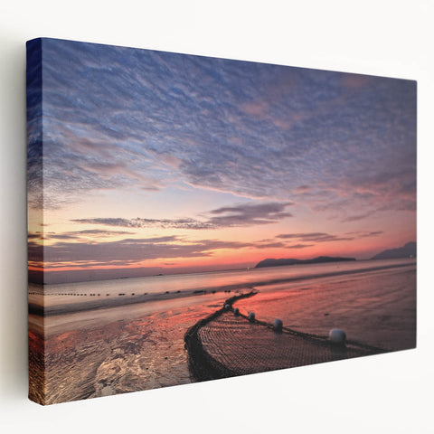 Side view of a large stretched canvas depicting a Malaysian landscape in vibrant green and blue tones.