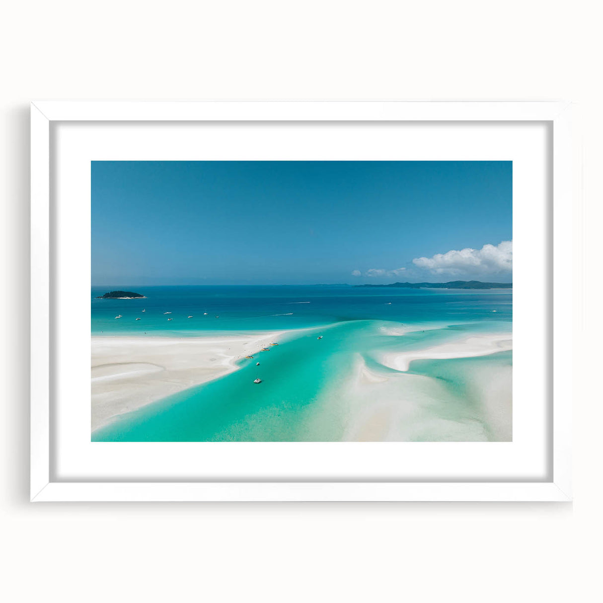Extra large wall art of the Great Barrier Reef in abstract style with textured blue and green hues, framed in white.