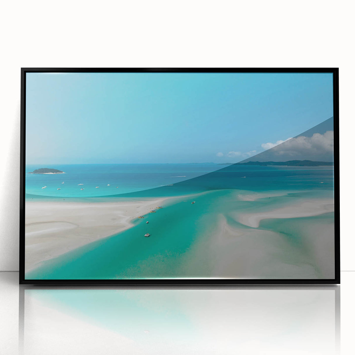 Large abstract wall art of the Great Barrier Reef in muted blue and green tones on a framed acrylic.