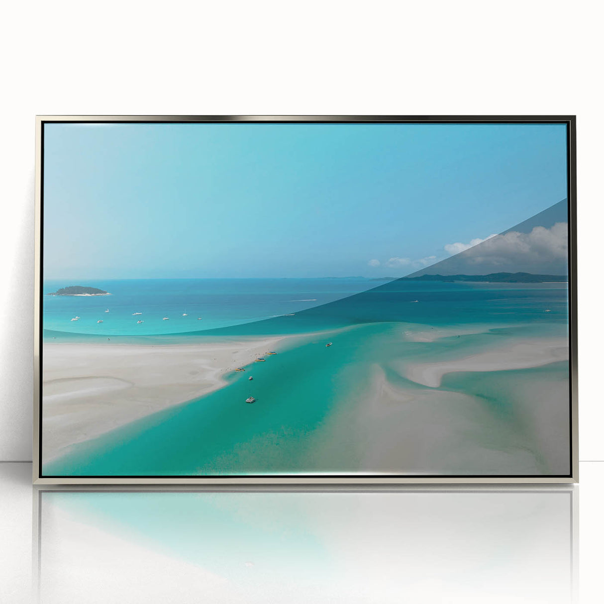 Acrylic print of the Great Barrier Reef in silver frame, featuring vibrant blue and green tones.