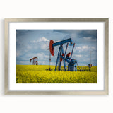 Textured abstract art print of Saskatchewan scenery in muted earth tones, framed in silver, suitable for bedroom decor.