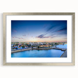 Extra large abstract art print of Caribbean scenery in muted blue and green tones, framed in silver.