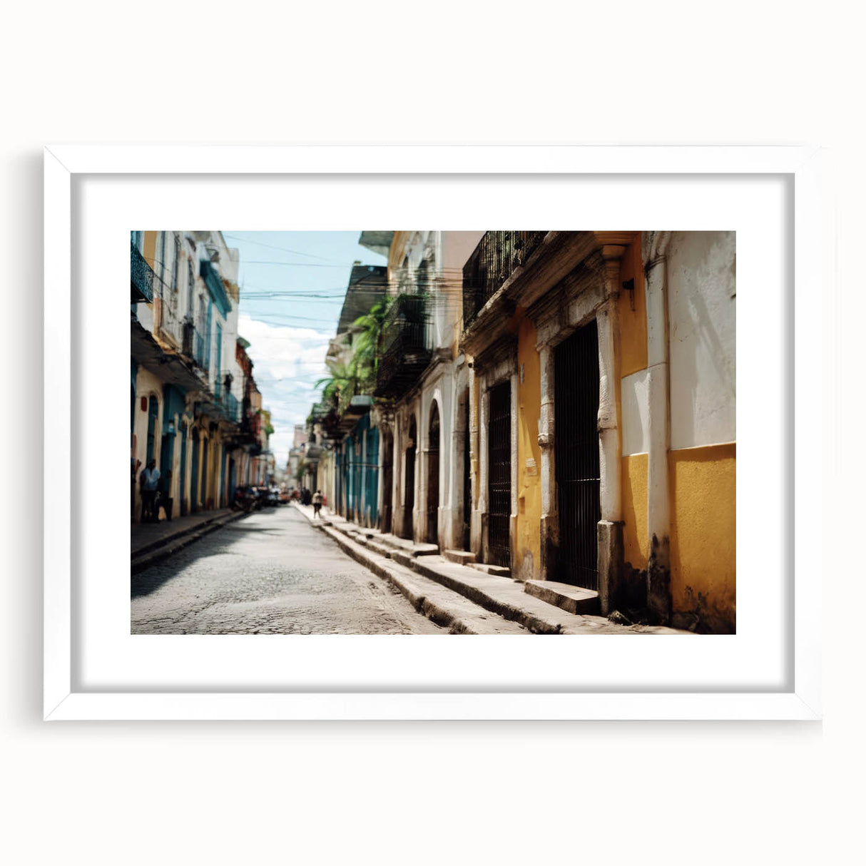 Textured abstract art print of Caribbean scenery in muted blue and green tones, framed with a white mat.