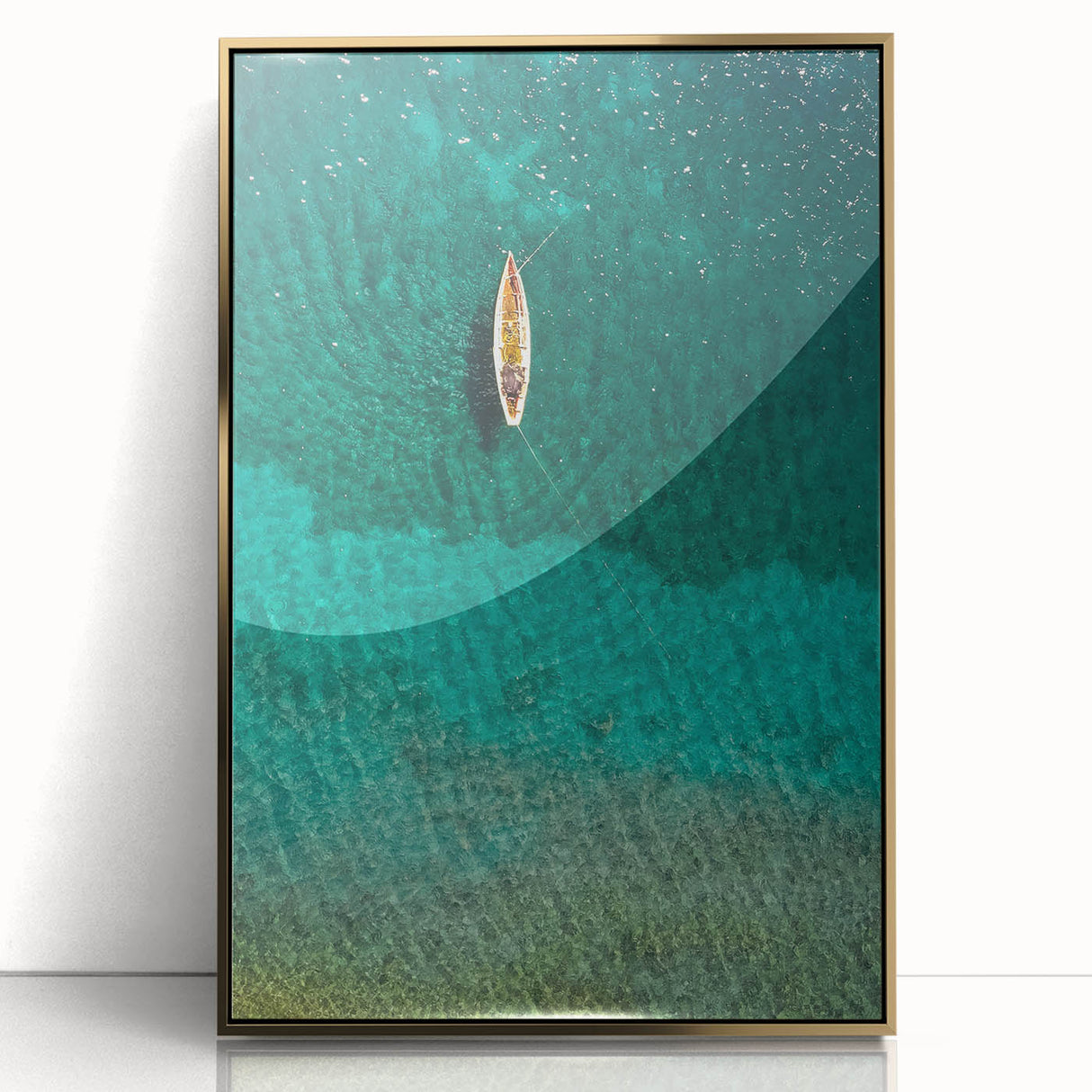 Large art print of a Caribbean Saint Lucia scenery in gold framed acrylic, depicting vibrant ocean blues and lush greens.
