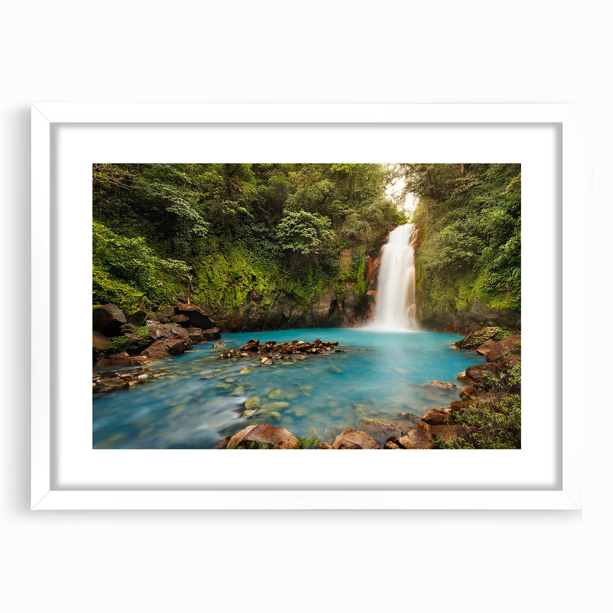 Abstract art print of a Central American landscape in muted earth tones, framed in white.