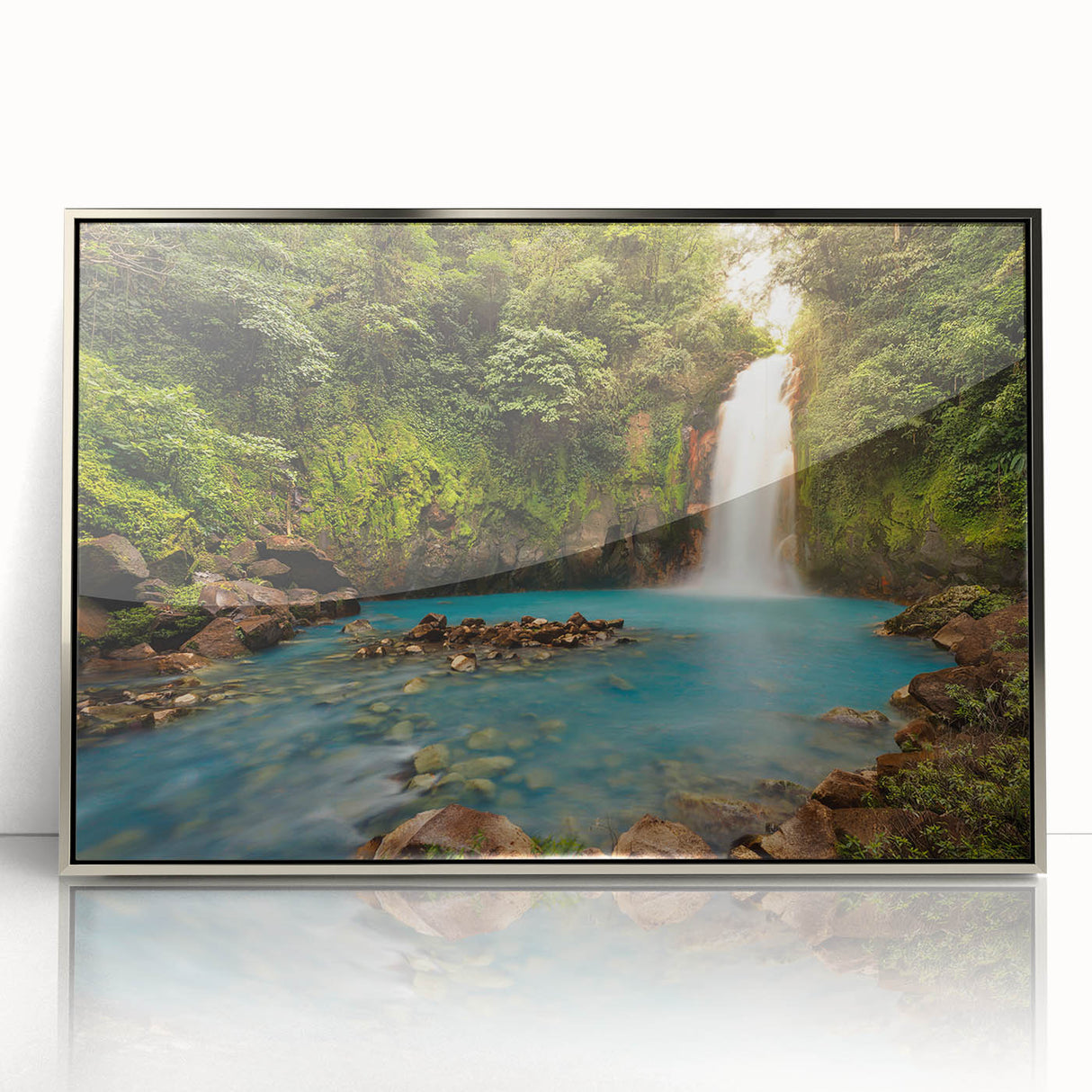 Mid-century modernist art depicting a serene Costa Rican landscape in muted green and blue tones, framed in silver acrylic.