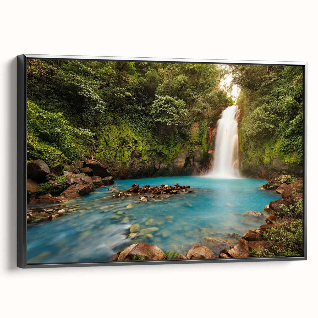 Black and white framed canvas featuring a vintage-style landscape painting of a Costa Rican scenery.