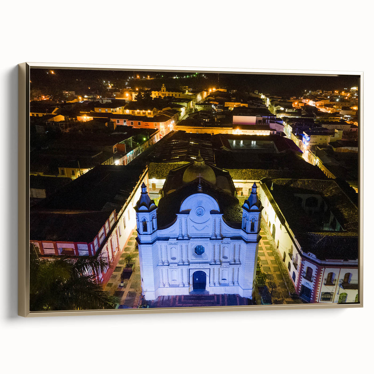 Framed canvas wall art of a vintage-style Honduran landscape in muted gold and black tones, ideal for bedroom decor.