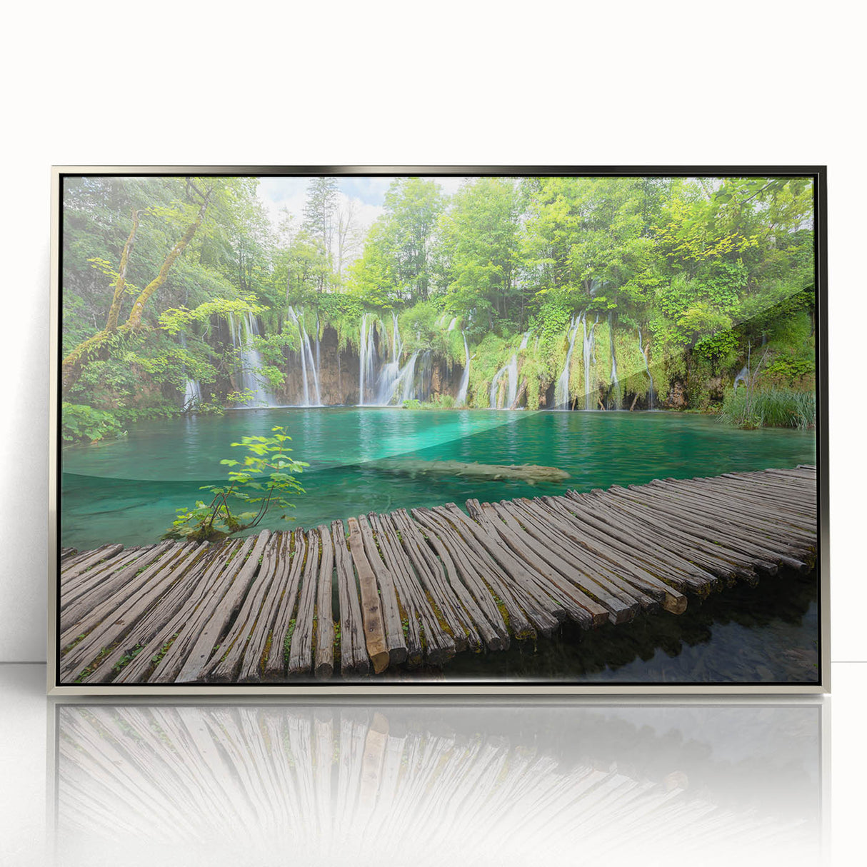 Large art print of a European Croatian landscape in muted green and blue tones, framed in silver acrylic.