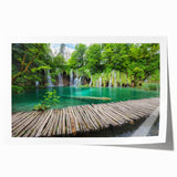 Scenic view of a Croatian landscape on a rolled print, featuring vibrant green and blue tones.