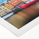 Art deco poster of a European cityscape in muted blues and grays on rolled canvas, suitable for dining room decor.
