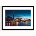 Extra large abstract art print of the Thames River in vibrant colors on a textured canvas, framed in black.