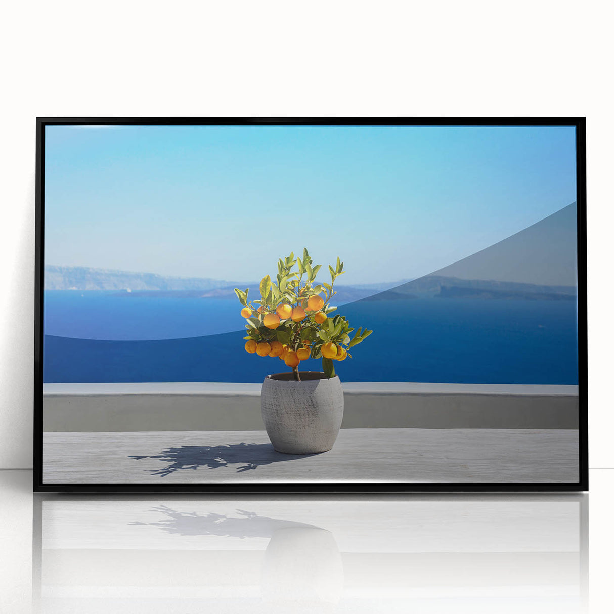 Large abstract wall art depicting the Santorini skyline in muted blue and white tones on a framed acrylic print.